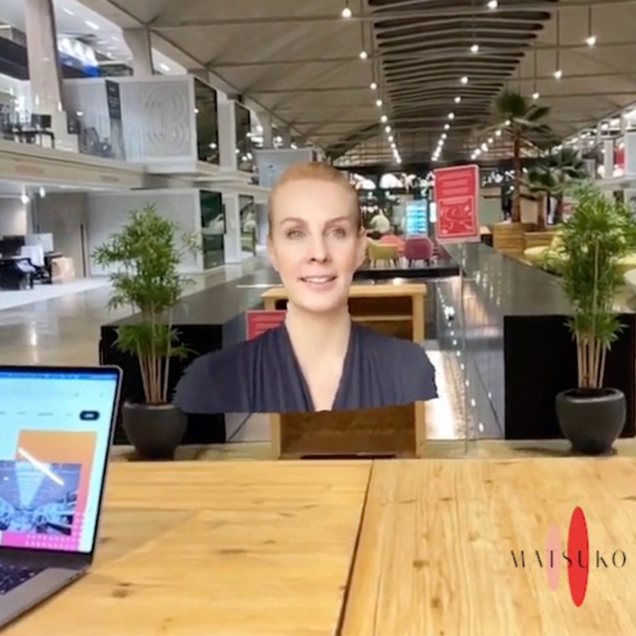 An woman image in holographic communication in a big open space